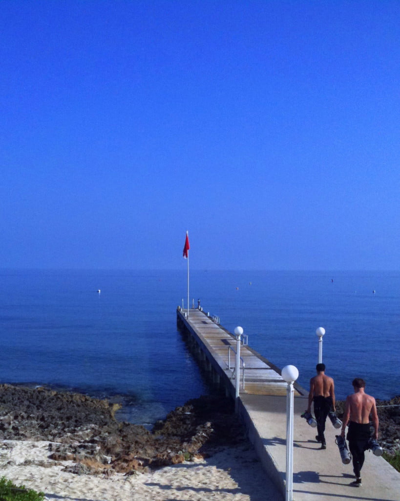 Divers walking to water